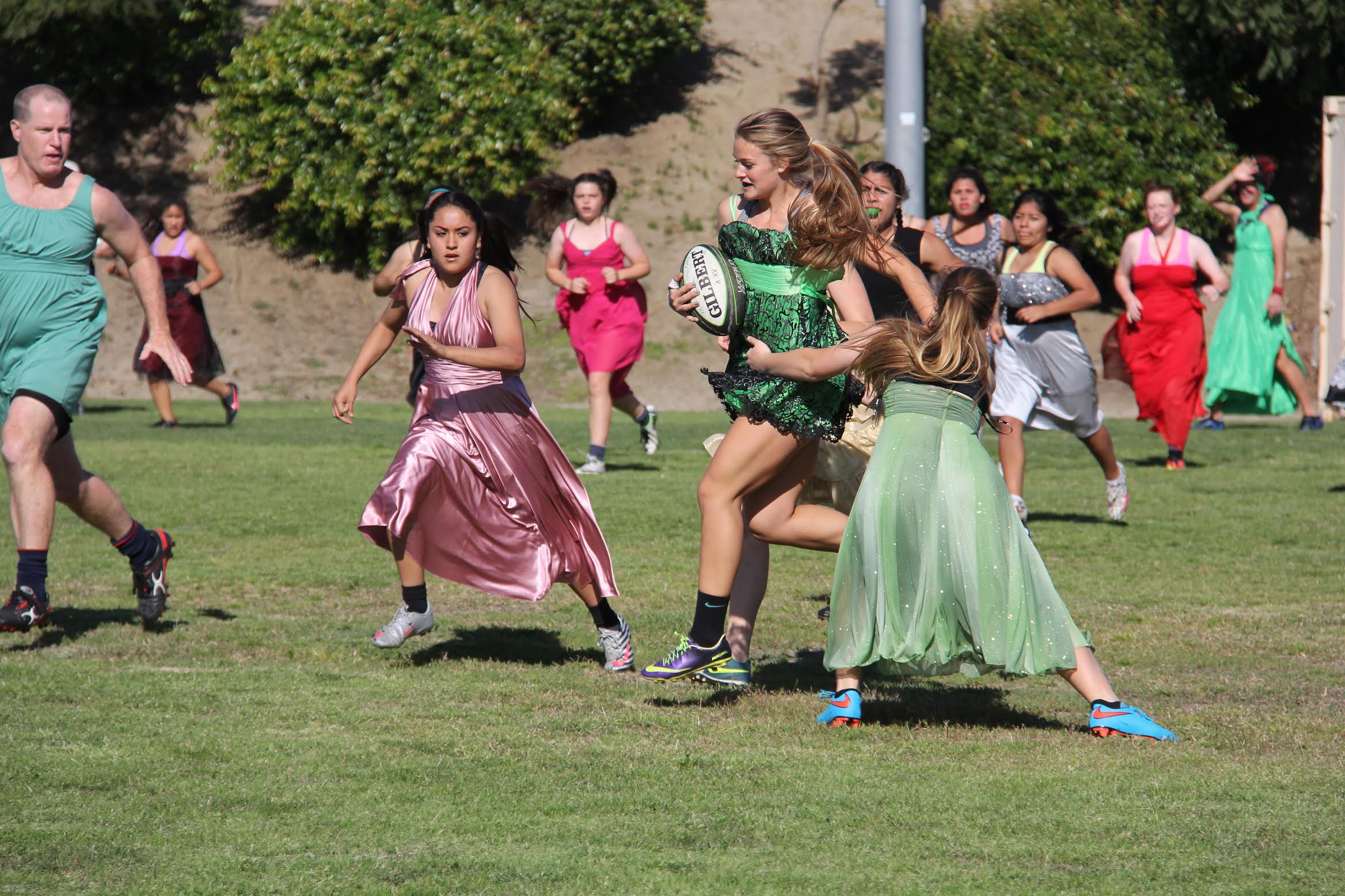 Girls have fun playing rugby in prom dresses - Village News